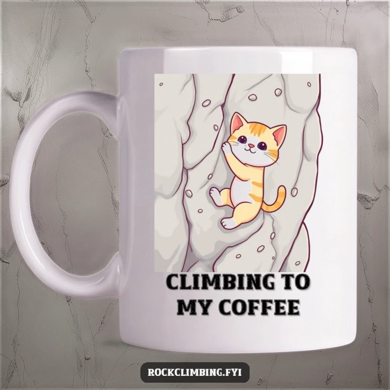 Funny cat mug showing a determined cat using suction cups to climb a sheer rock face, a humorous display of skill.