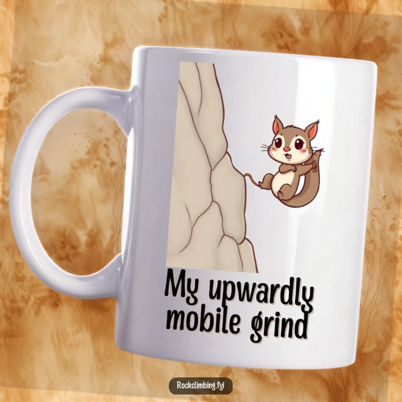 Funny squirrel mug featuring a determined rodent using a tiny rope to scale a steep cliff, symbolizing perseverance and strength.