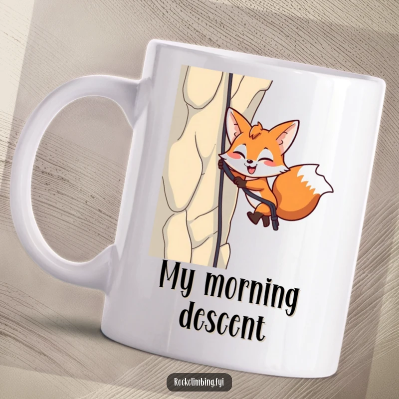 Funny Fox Rappelling Mug: Energetic fox winks while rappelling down a cliff, perfect for outdoor lovers gift.