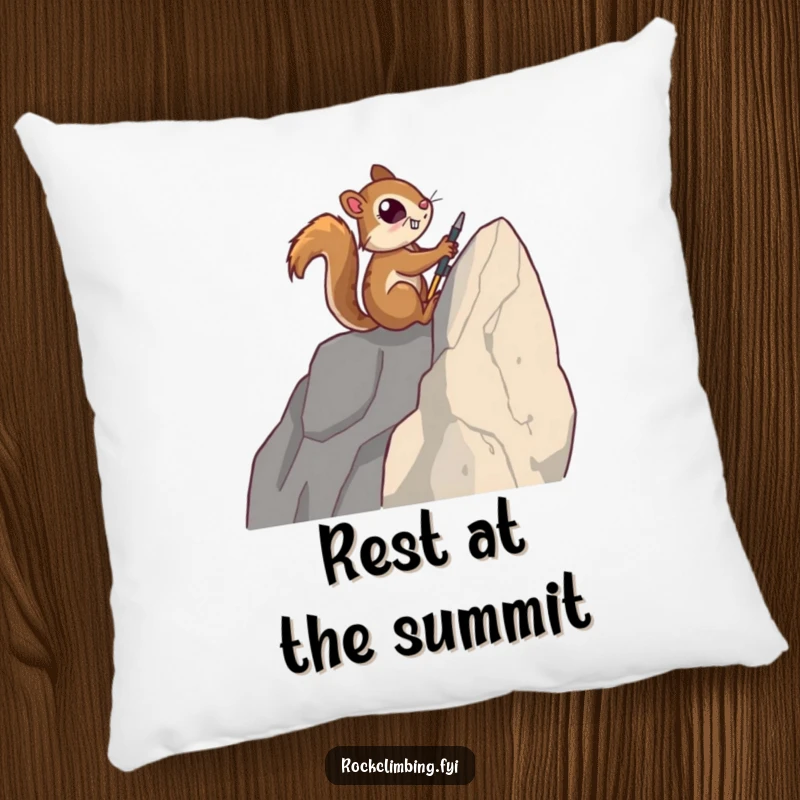 Funny pillow featuring a determined squirrel using tiny tools to climb a sheer rock face, ready for a well-deserved rest.