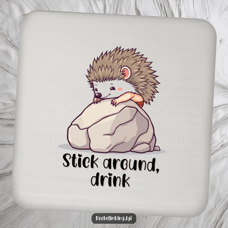 Tiny hedgehog using suction cups to climb a smooth boulder on a set of drink coasters.