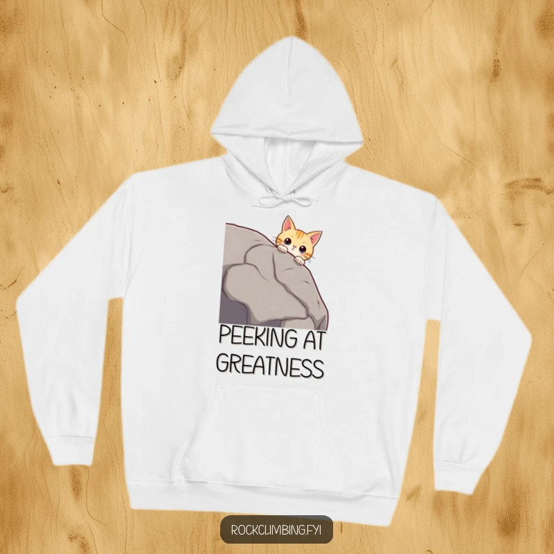 Funny curious cat peering over a massive boulder edge, whiskers twitching, looking intrigued, a cozy funny hoodie.