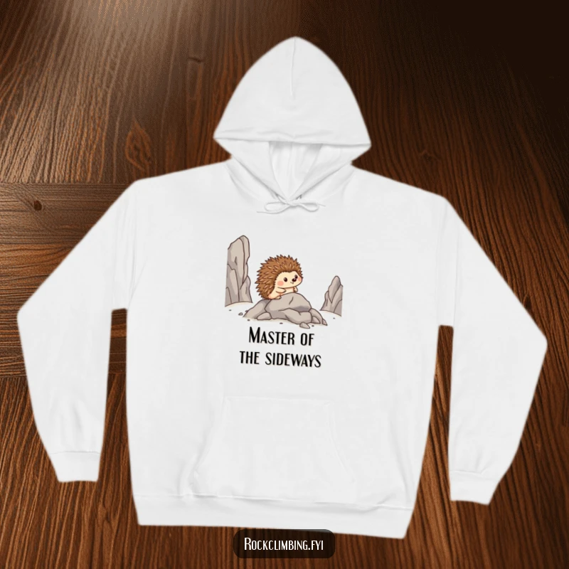 Funny hoodie featuring a proud hedgehog moving sideways on a rocky path, embodying bravery and humor.
