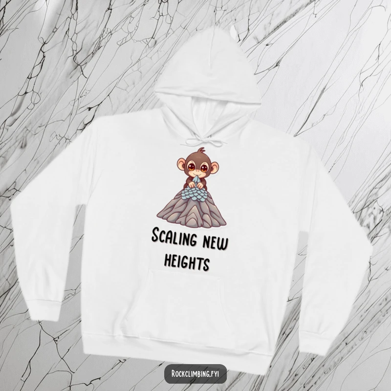 Funny Hoodie with a cute monkey with bright eyes scaling a miniature mountain peak, perfect for cozy adventurers.