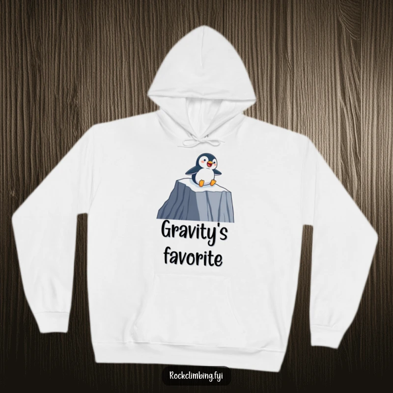 Funny Hoodie with a happy penguin joyfully sliding down a sheer cliff face on its belly, perfect for cozy fun.