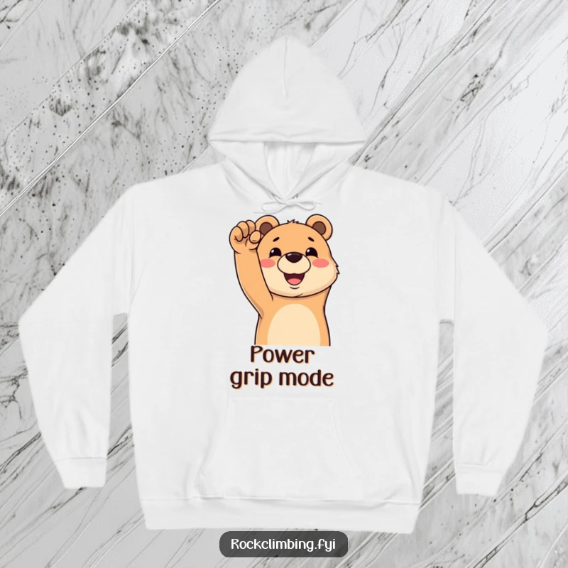 Funny hoodie depicting a happy bear grinning as it reaches for a challenging climbing hold, symbolizing a joyful pursuit.