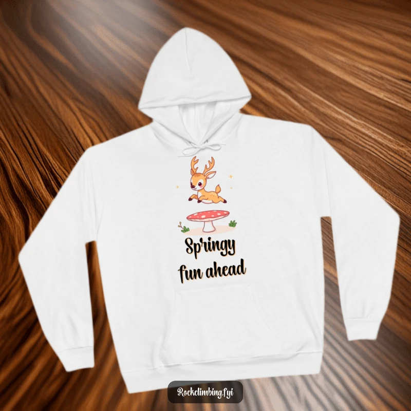Funny hoodie, a happy deer bouncing high on a mushroom trampoline, capturing a moment of pure, humorous, natural delight.
