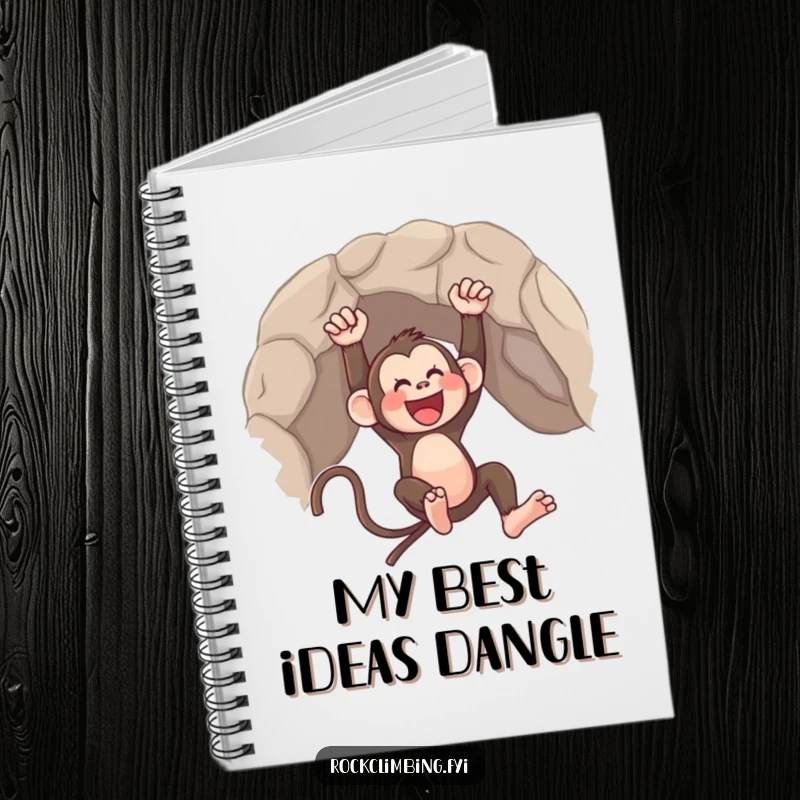 Funny notebook with a cover showing a happy monkey swinging from a rocky overhang, ready for notes.
