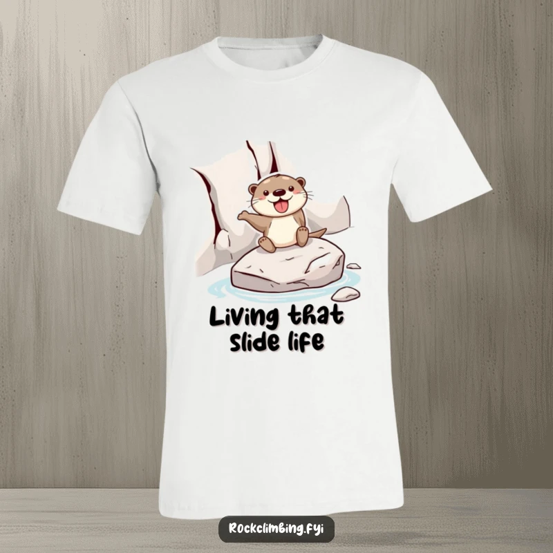 Funny otter t-shirt featuring a joyful otter sliding down a rock face on a smooth stone, conveying exhilaration and fun.