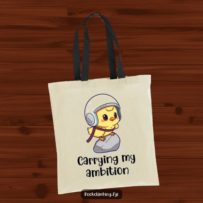Funny determined chick with helmet, scaling a tiny pebble, on a practical and humorous tote bag.