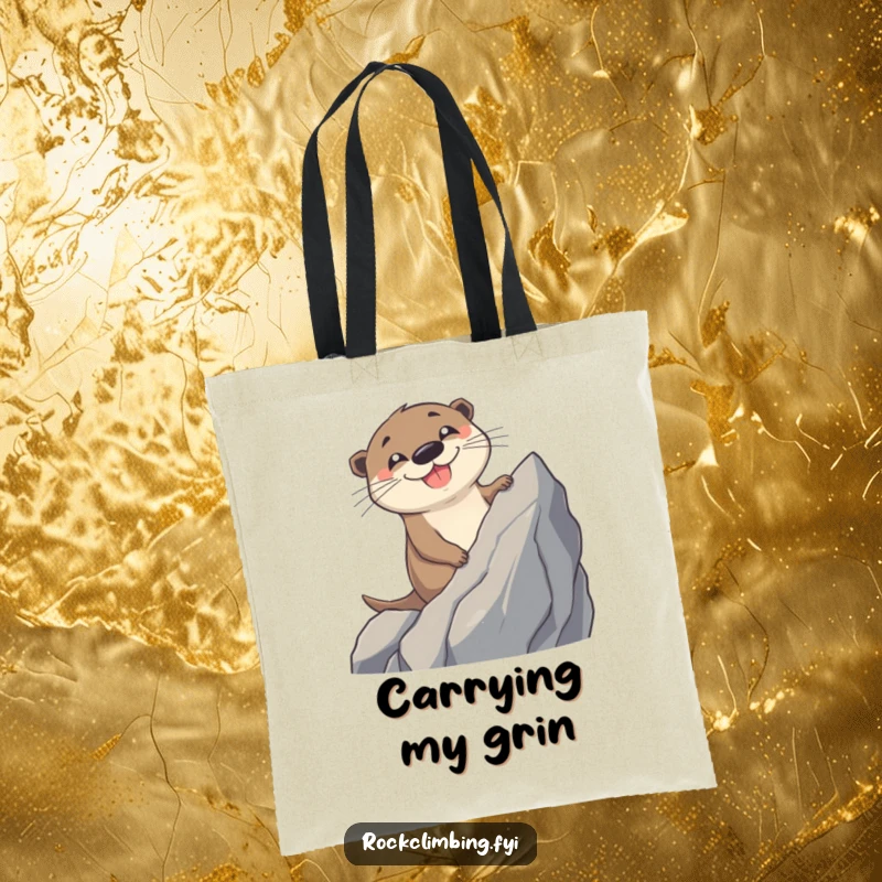 Funny Otter Tote Bag: A cheerful otter sporting a massive grin scales a rugged, jagged rock, ready for any adventure.