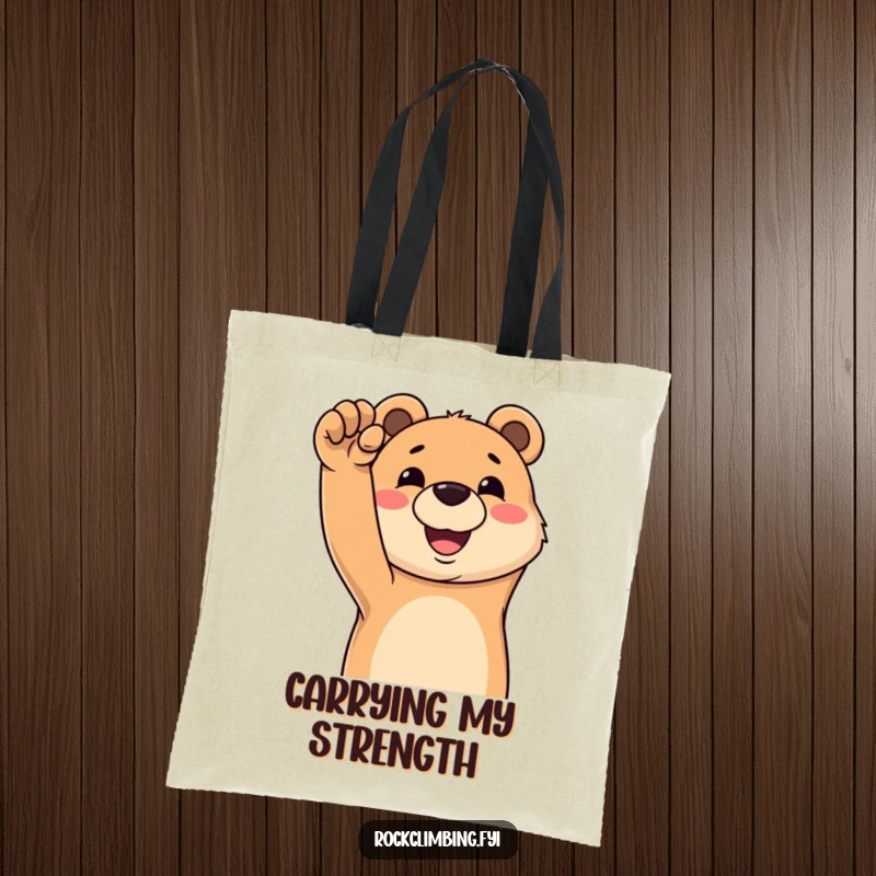 Funny tote bag featuring a happy bear grinning while reaching for a challenging climbing hold, ready for its next ascent.