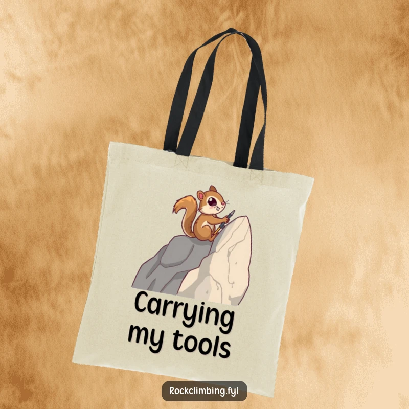 Funny tote bag featuring a determined squirrel using tiny tools to ascend a sheer rock face, ready for its next summit.