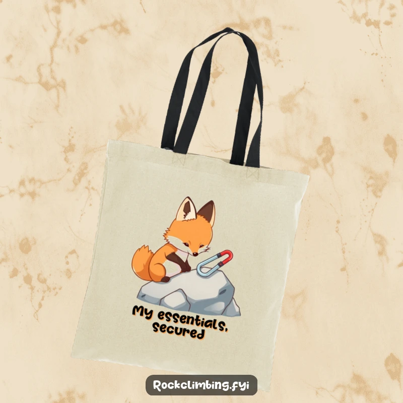 Funny fox tote bag, depicting a focused fox carefully attaching a miniature carabiner to a rock, ideal for carrying essentials.